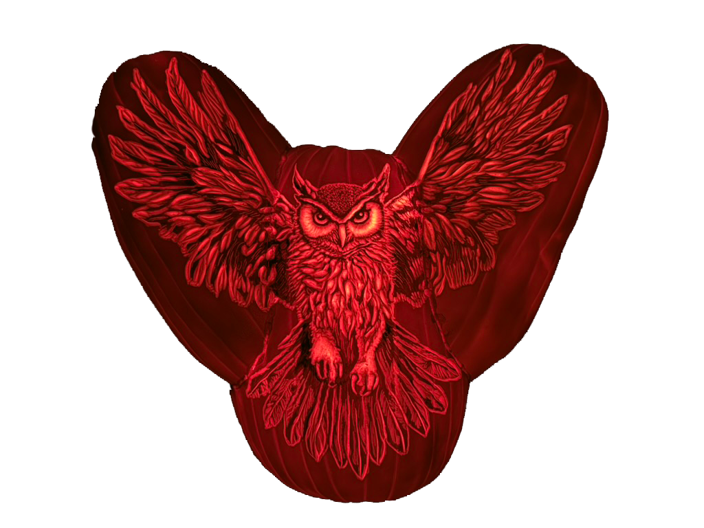 Hand-carved illuminated owl pumpkin sculpture with wings spread